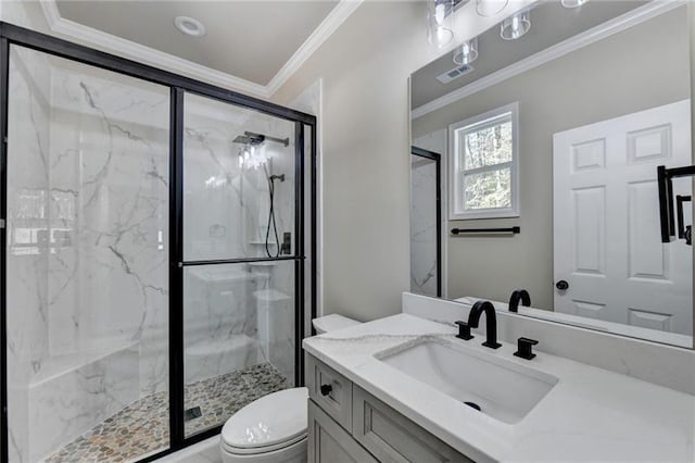 bathroom featuring a marble finish shower, visible vents, toilet, crown molding, and vanity