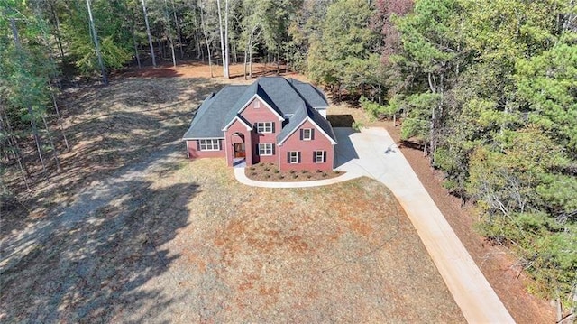 aerial view featuring a wooded view