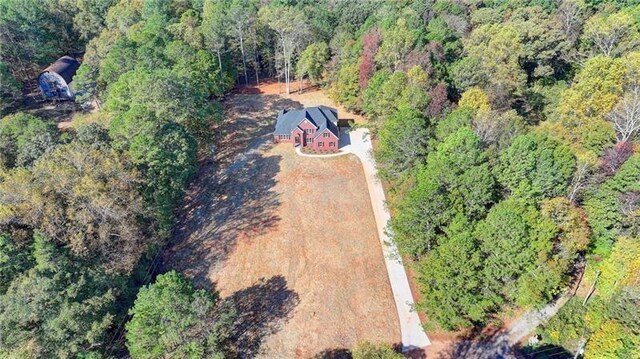 bird's eye view featuring a view of trees