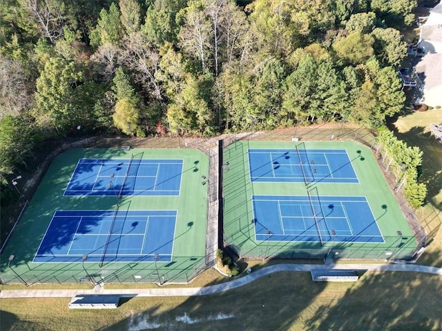 bird's eye view featuring a wooded view