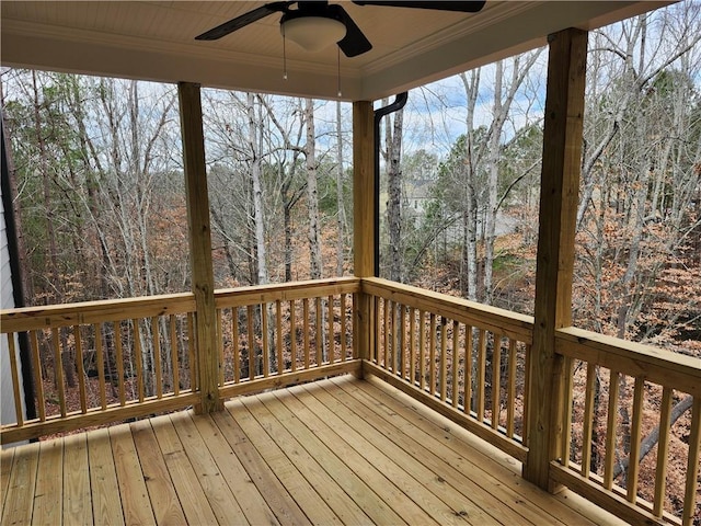 wooden deck with a ceiling fan