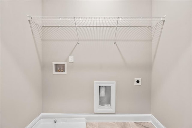 laundry room featuring laundry area, baseboards, washer hookup, and hookup for an electric dryer