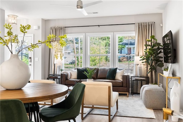 sunroom / solarium with ceiling fan and visible vents