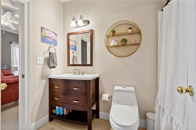 bathroom featuring ceiling fan, toilet, vanity, and tile patterned flooring