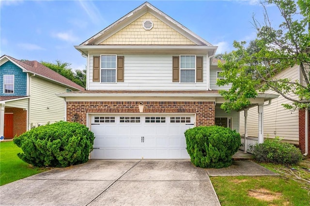 view of front of home with brick siding, driveway, and an attached garage