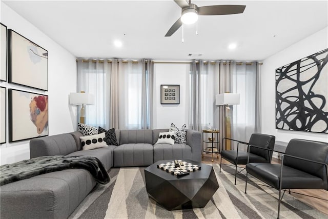 living area featuring a healthy amount of sunlight, a ceiling fan, recessed lighting, and visible vents