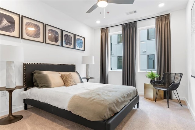 carpeted bedroom featuring baseboards, a ceiling fan, recessed lighting, and visible vents