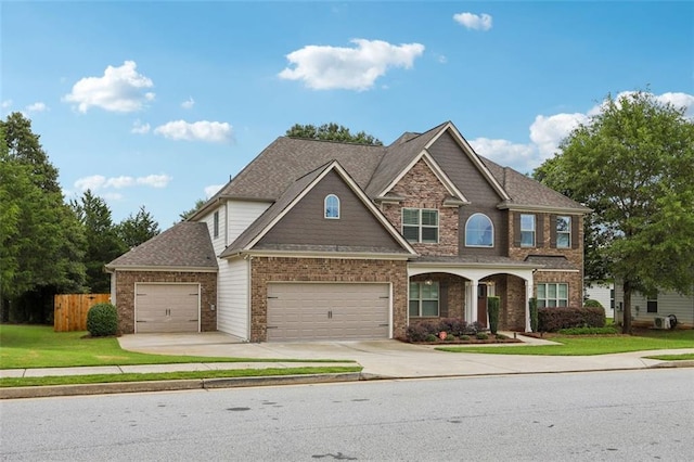 view of front of home featuring a garage and a front lawn