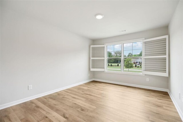 empty room with light wood-type flooring