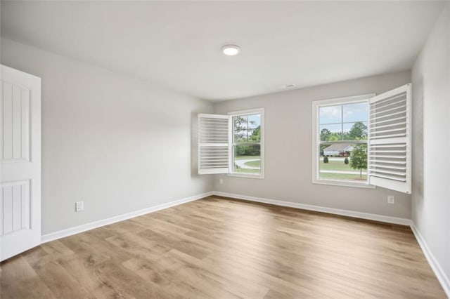 unfurnished room featuring light hardwood / wood-style flooring