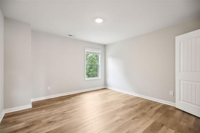 empty room featuring hardwood / wood-style flooring