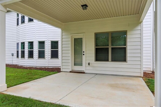 doorway to property with a patio