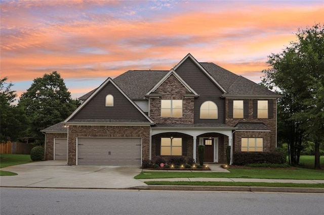 view of front of house with a lawn and a garage