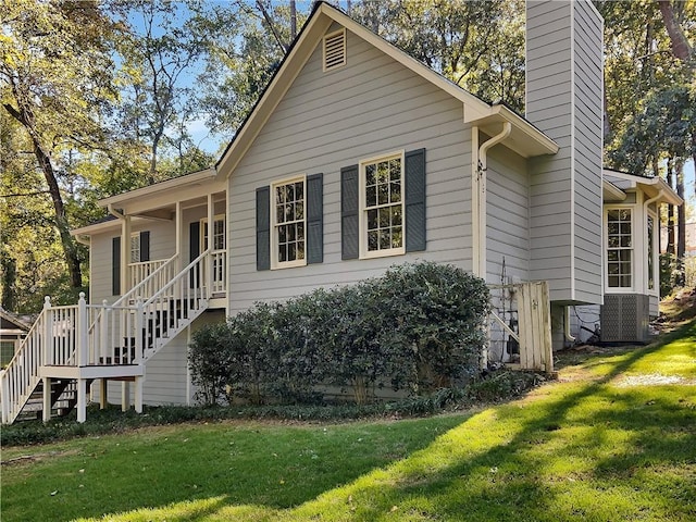 view of side of property with a yard