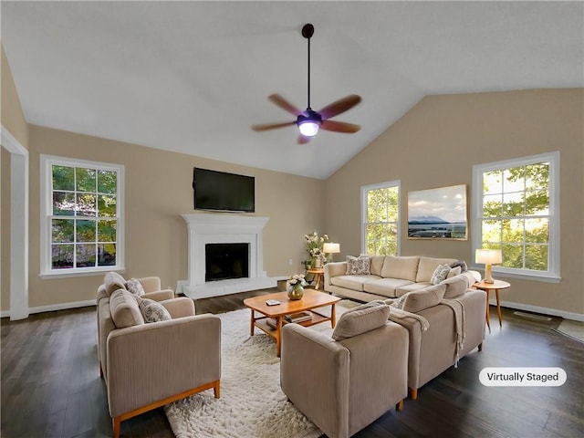 living room featuring dark wood-type flooring, ceiling fan, and high vaulted ceiling