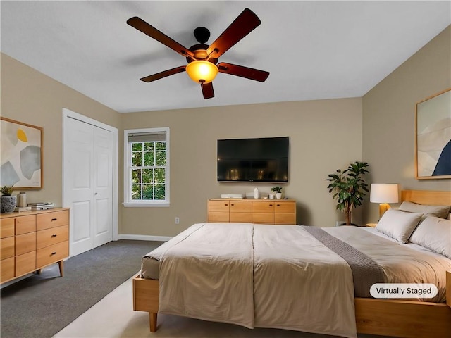 bedroom featuring a closet, dark carpet, and ceiling fan