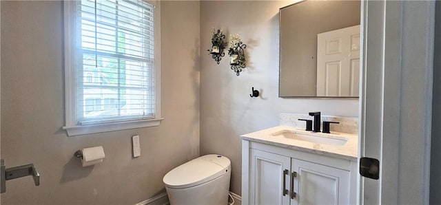 4230 Glen Vista Ct, Duluth, GA 30097 - bathroom with toilet, vanity, and plenty of natural light