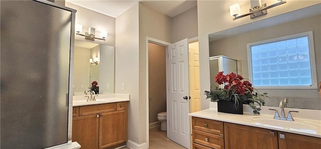 4230 Glen Vista Ct, Duluth, GA 30097 - full bathroom with a shower stall, two vanities, and toilet