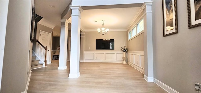 4230 Glen Vista Ct, Duluth, GA 30097 - entrance foyer featuring stairway, decorative columns, light wood finished floors, a chandelier, and crown molding