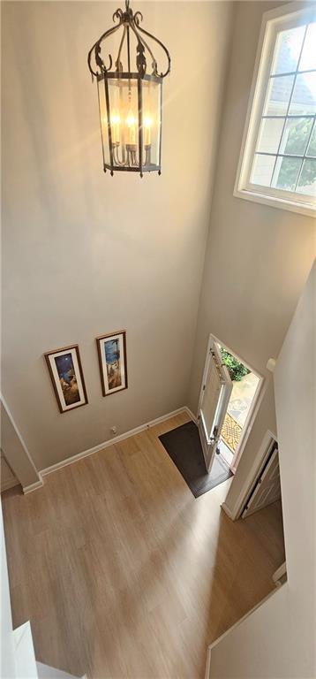 4230 Glen Vista Ct, Duluth, GA 30097 - foyer featuring a chandelier, wood finished floors, and baseboards