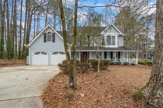 view of front of home featuring covered porch and a garage