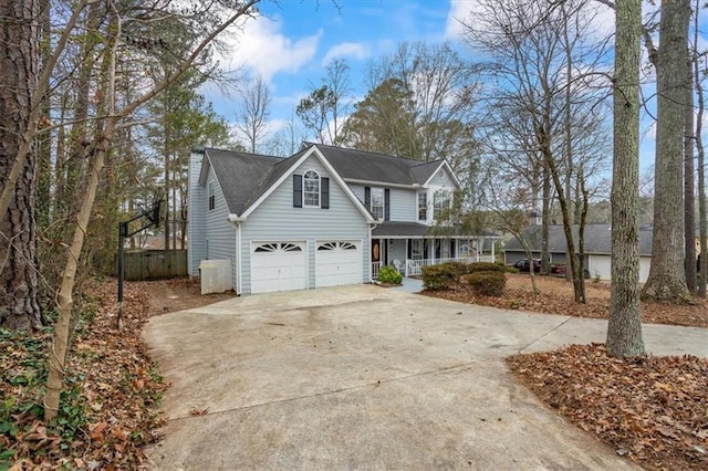 view of front facade with a porch and a garage