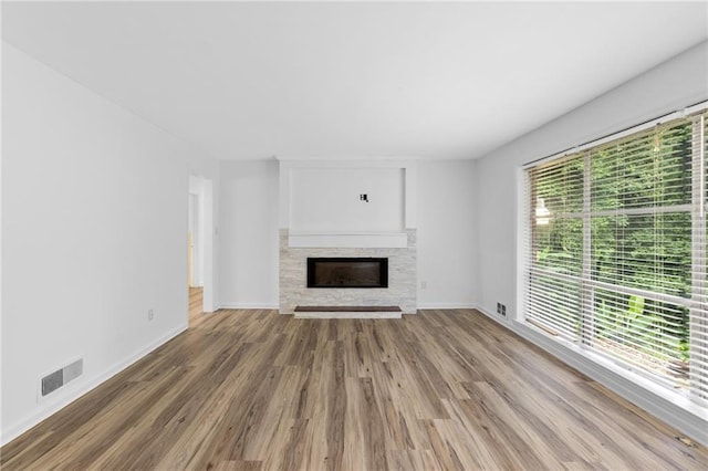 1966 Briarwood Dr, Gainesville, GA 30501 - unfurnished living room with a fireplace, wood finished floors, and baseboards