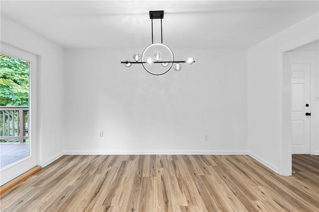 1966 Briarwood Dr, Gainesville, GA 30501 - unfurnished dining area with a chandelier, light wood-style flooring, and baseboards