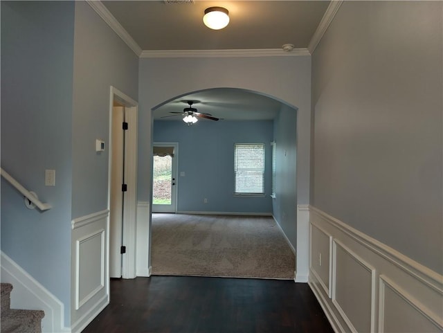 corridor featuring dark hardwood / wood-style floors and ornamental molding