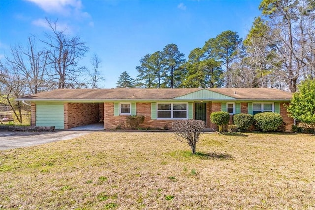 ranch-style home with a front yard, brick siding, driveway, and an attached carport