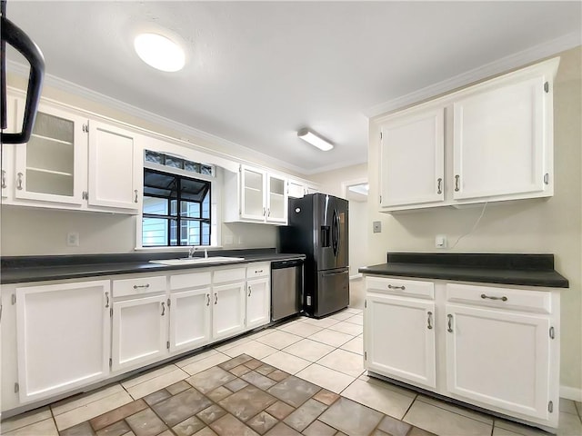 kitchen featuring sink, stainless steel appliances, ornamental molding, light tile patterned floors, and white cabinetry