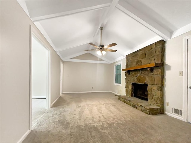 unfurnished living room featuring vaulted ceiling with beams, a fireplace, carpet, and ceiling fan