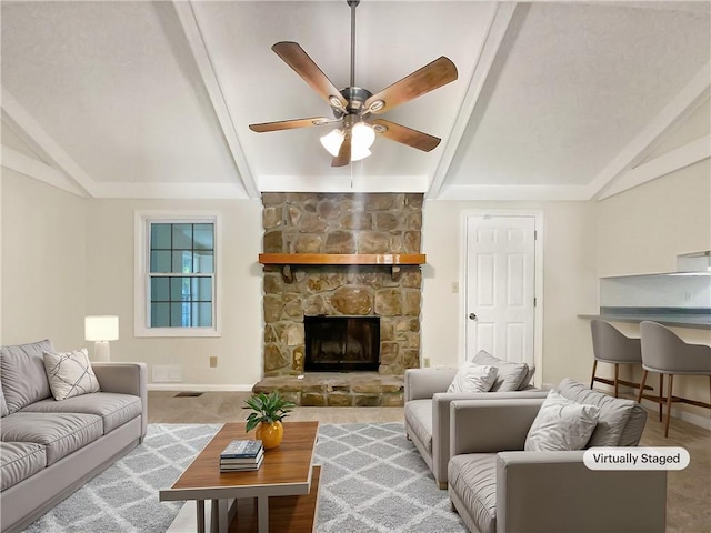 living room featuring ceiling fan, a fireplace, and lofted ceiling with beams