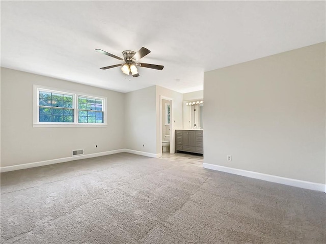 interior space with ceiling fan