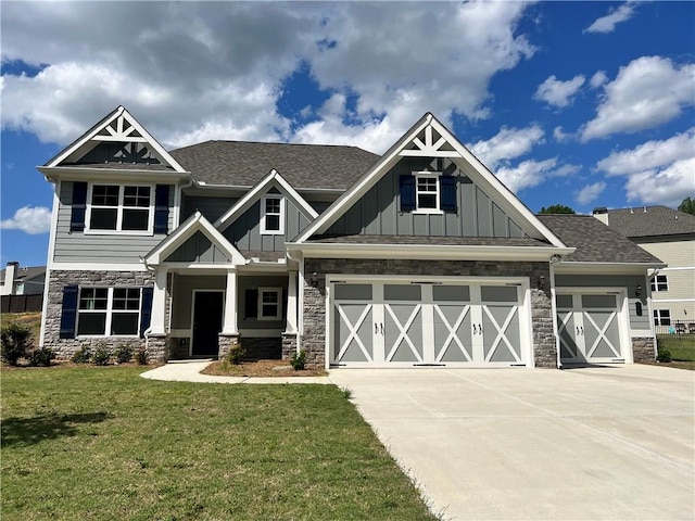 craftsman-style house with a front yard and a garage