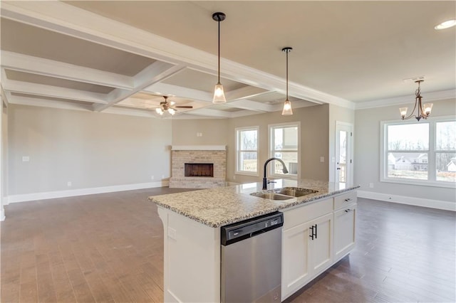 kitchen featuring stainless steel dishwasher, a center island with sink, sink, dark hardwood / wood-style floors, and white cabinets