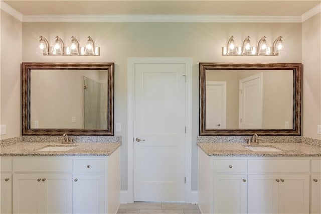 bathroom with tile flooring, oversized vanity, and crown molding