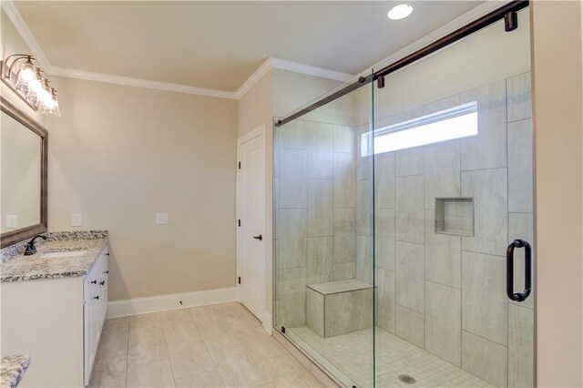 bathroom with walk in shower, tile floors, ornamental molding, and oversized vanity