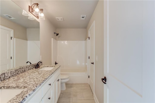 full bathroom featuring vanity, tile floors, toilet, and bathing tub / shower combination