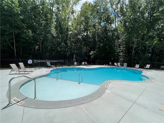 view of swimming pool with a patio area