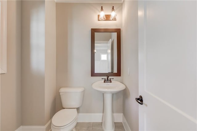 bathroom with tile floors and toilet