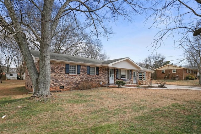 single story home featuring a front yard and covered porch