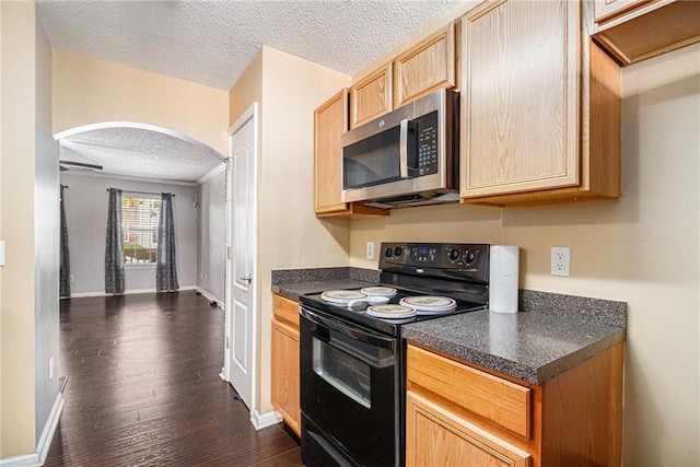 3262 Cascade Parc Blvd, Atlanta, GA 30311 - kitchen featuring black / electric stove, stainless steel microwave, a textured ceiling, arched walkways, and dark countertops
