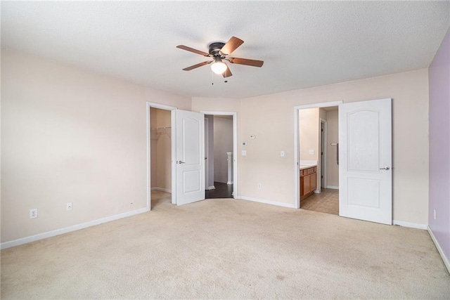 3262 Cascade Parc Blvd, Atlanta, GA 30311 - unfurnished bedroom featuring light colored carpet, a walk in closet, baseboards, and connected bathroom