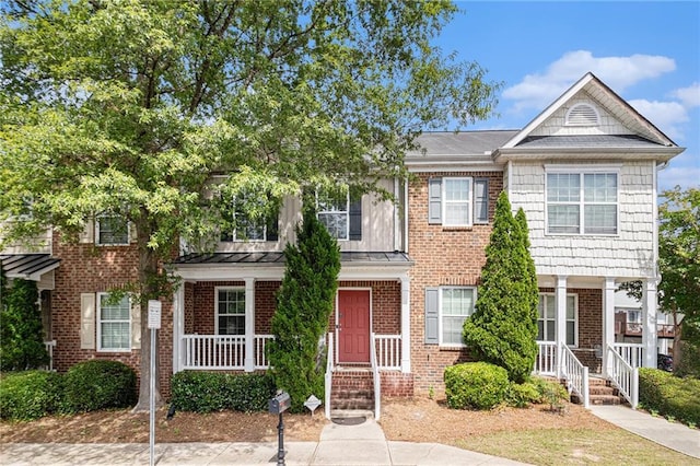 3262 Cascade Parc Blvd, Atlanta, GA 30311 - view of property with covered porch, brick siding, and a standing seam roof
