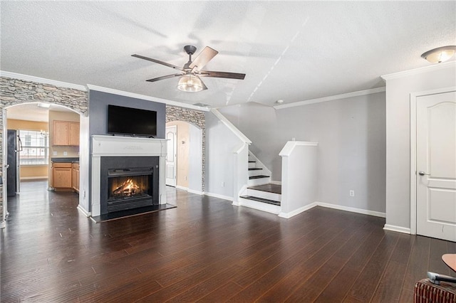 3262 Cascade Parc Blvd, Atlanta, GA 30311 - unfurnished living room with ceiling fan, arched walkways, wood finished floors, stairway, and ornamental molding