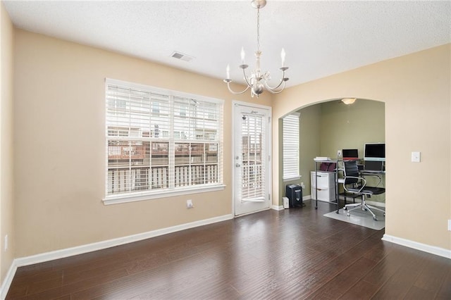 3262 Cascade Parc Blvd, Atlanta, GA 30311 - home office featuring arched walkways, a chandelier, wood finished floors, baseboards, and a textured ceiling