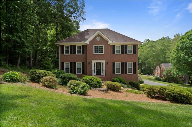 4423 Windsor Oaks Cir, Marietta, GA 30066 - colonial house featuring a front yard and brick siding
