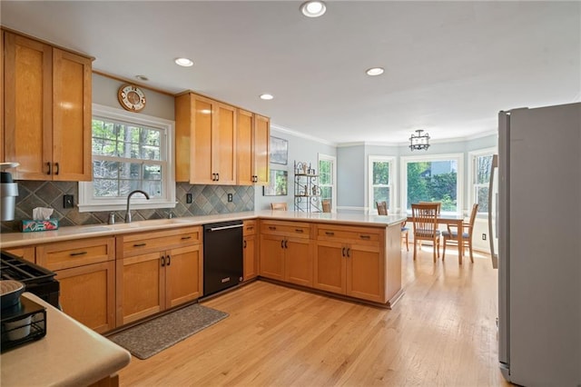 4423 Windsor Oaks Cir, Marietta, GA 30066 - kitchen featuring dishwasher, freestanding refrigerator, a sink, ornamental molding, and a peninsula