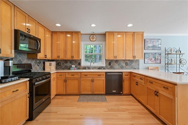 4423 Windsor Oaks Cir, Marietta, GA 30066 - kitchen featuring black microwave, dishwashing machine, gas stove, a peninsula, and light countertops